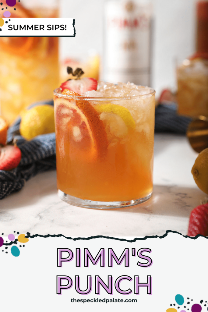 A glass of a Pimms drink garnished with blood orange, lemon and strawberry with the text Pimm's Punch