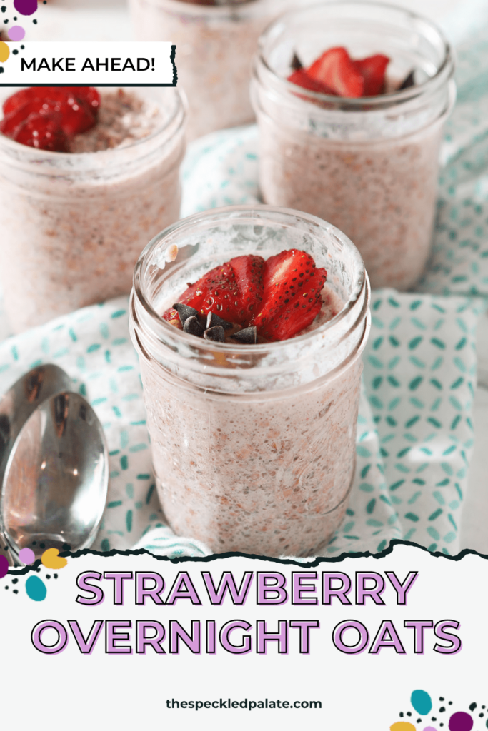 Close up of strawberry overnight oats in a mason jar garnished with almond butter, chocolate chips and sliced strawberries with the text Strawberry Overnight Oats