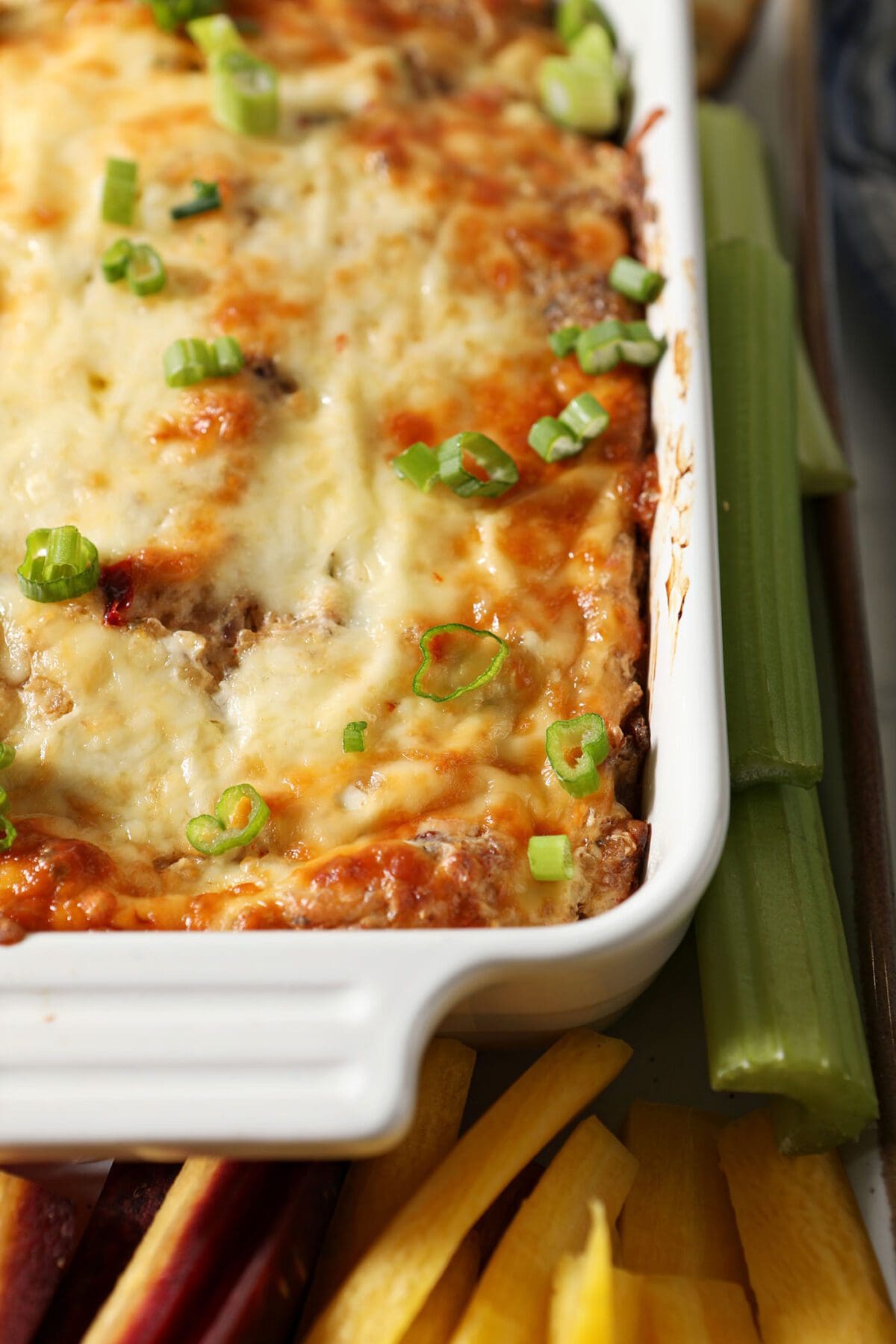Close up of a white container holding boudin dip