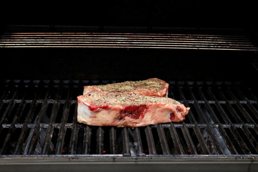 Two steaks on a grill