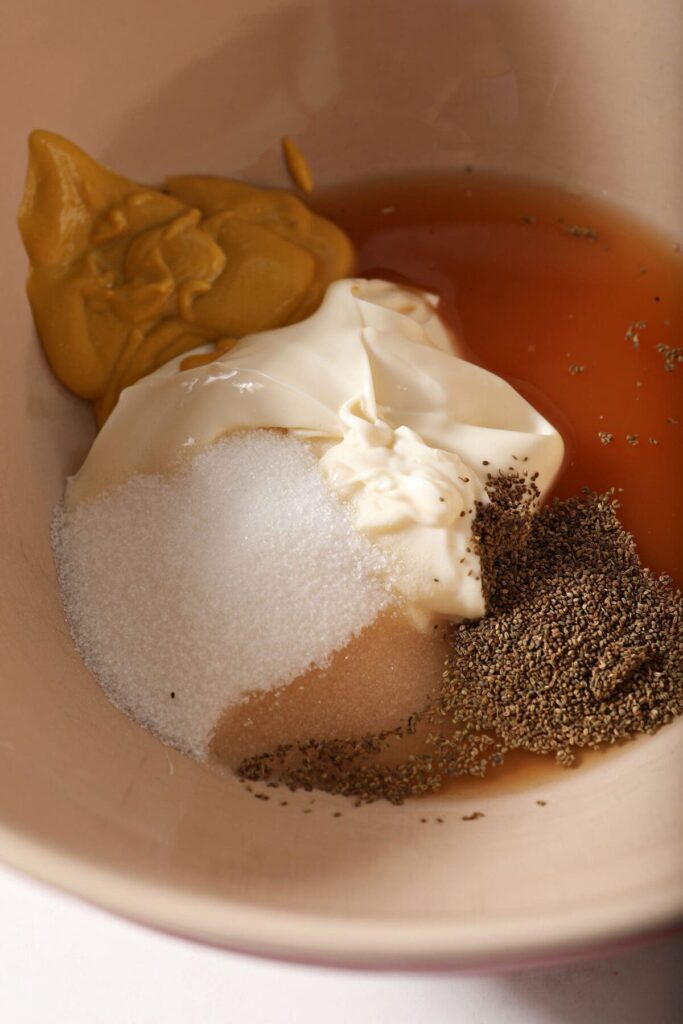 Ingredients to make a coleslaw dressing in a bowl