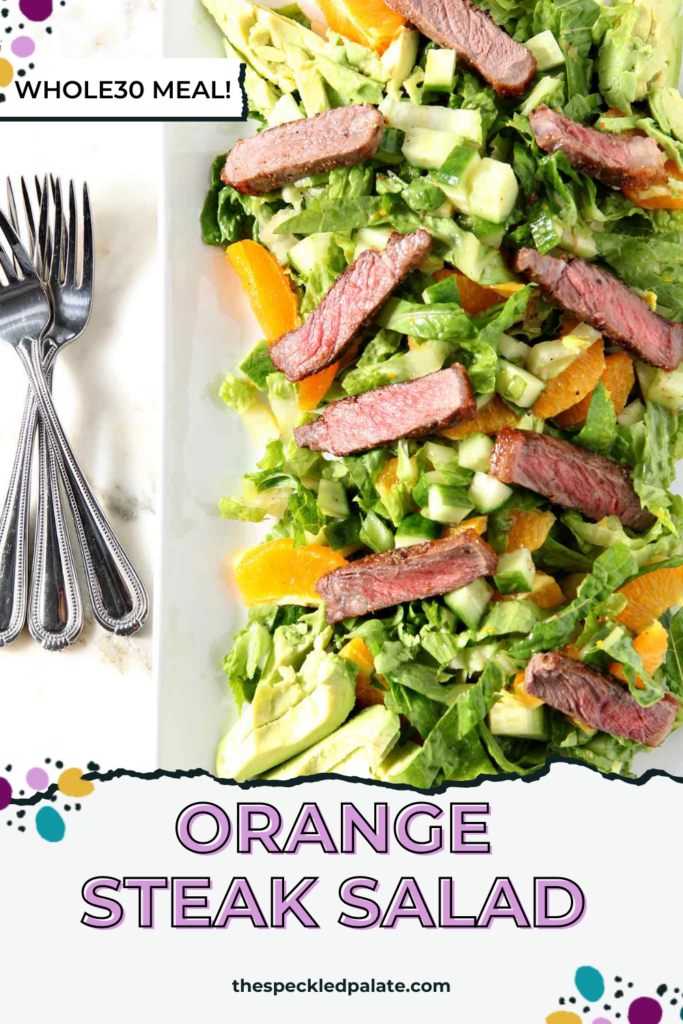 close up of a steak salad with orange slices and avocado on a white plate with the text Orange Steak Salad