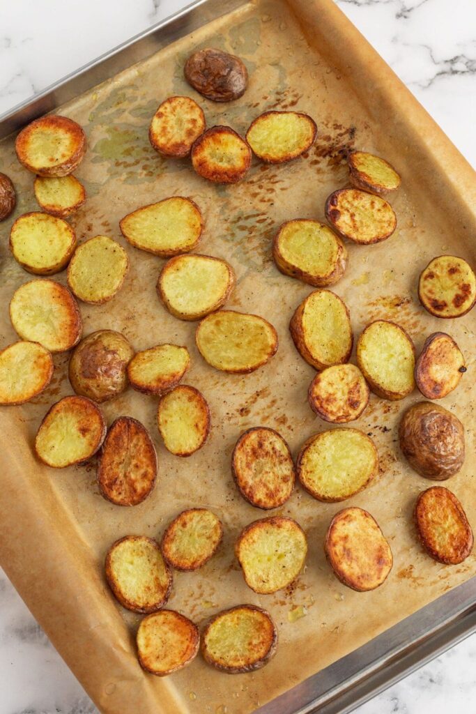 Gold potatoes on a sheet pan after roasting