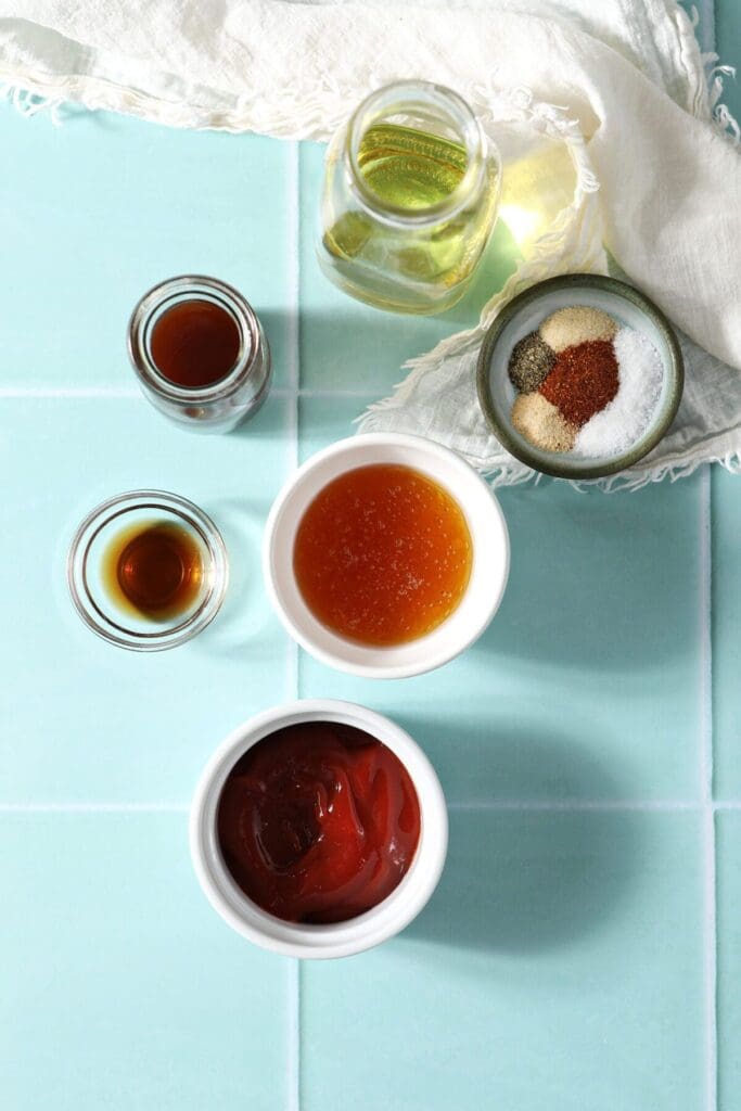 Ingredients to make homemade Catalina dressing on a turquoise tiled surface