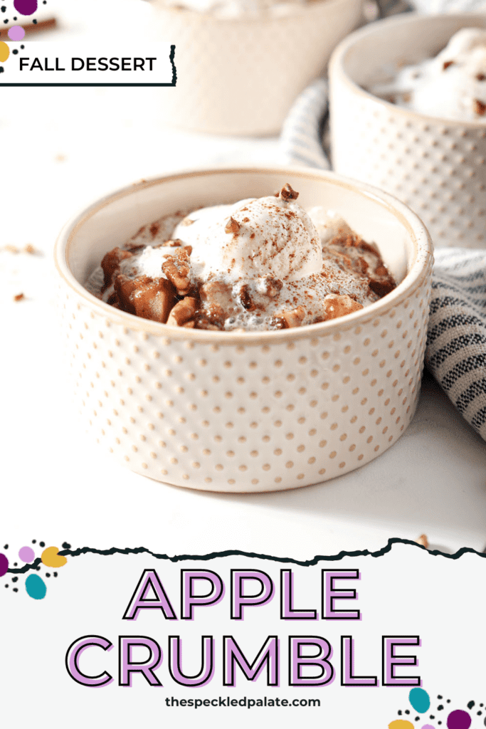 Close up of a bowl of apple crumble with ice cream on top with the text apple crumble