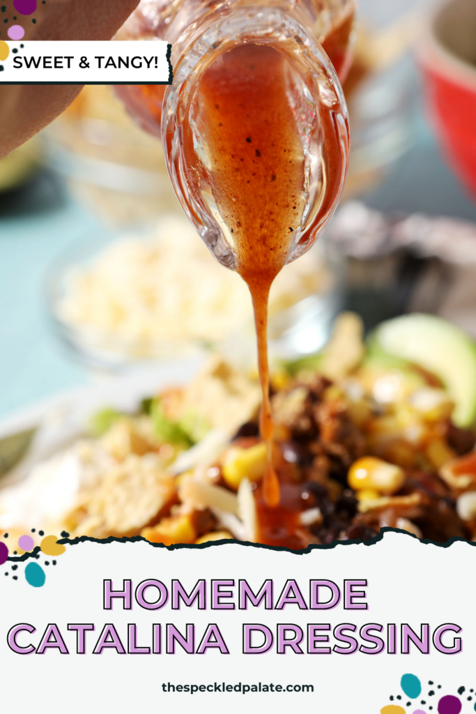 A glass vial of a red dressing pours on top of a taco salad with the text homemade catalina dressing