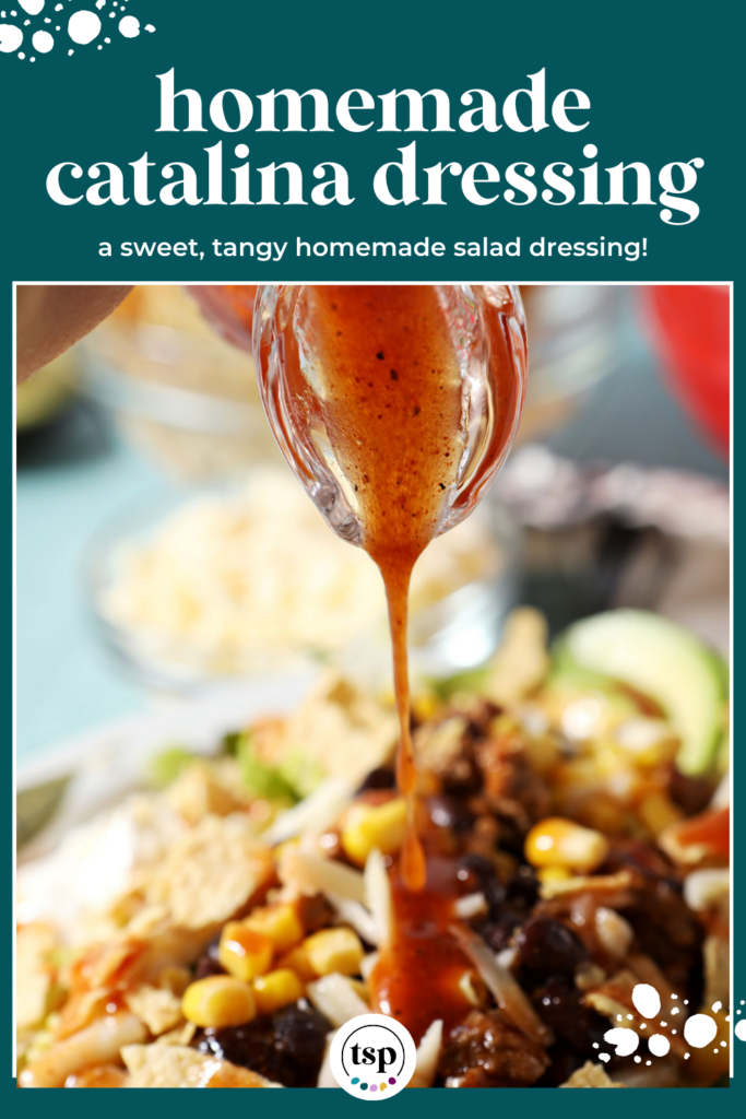 A glass vial of a red dressing pours on top of a taco salad with the text homemade catalina dressing a sweet, tangy homemade salad dressing!