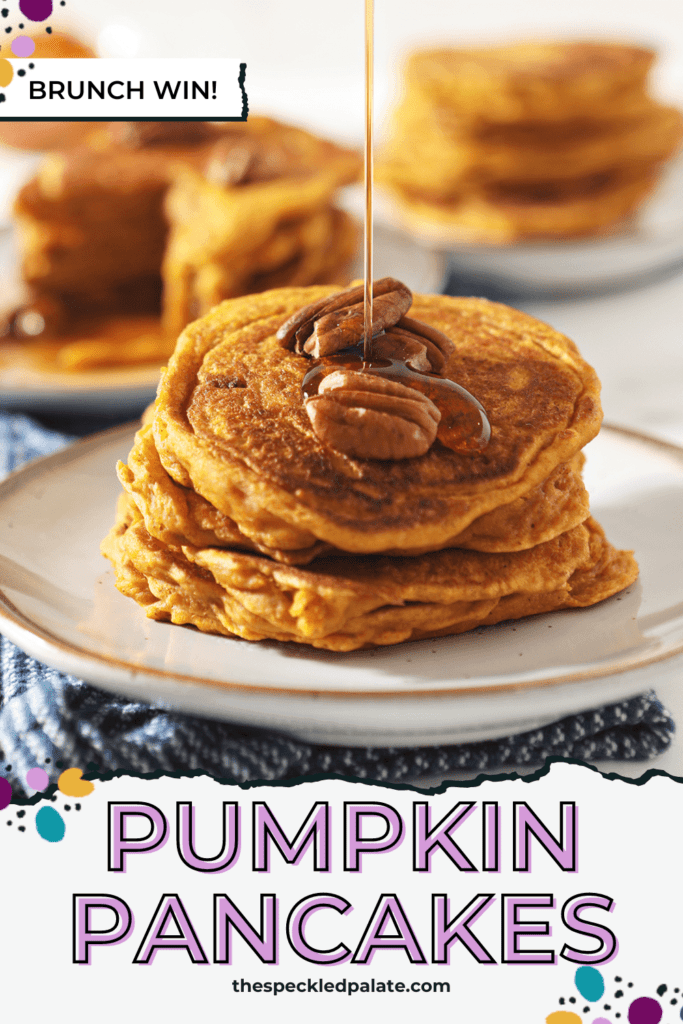 Syrup drizzles on top of a stack of Buttermilk Pumpkin Spice Pancakes with pecans on top with the text 'pumpkin pancakes'