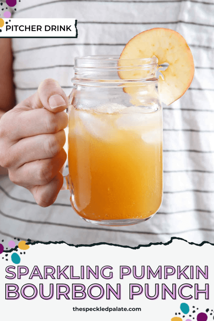 A woman holds a mason jar full of boozy apple cider punch in her hand with the text sparkling pumpkin bourbon punch