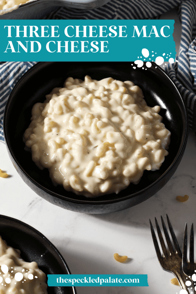 Two black bowls hold a serving of Mac and Cheese next to patterned blue napkins with the text three cheese Mac and cheese