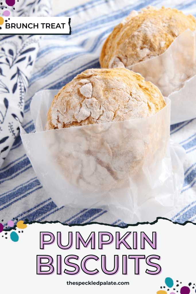 Two biscuits wrapped in parchment paper on linens with the text pumpkin biscuits