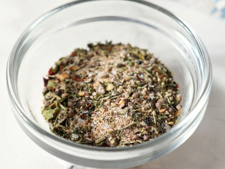 A small batch steak seasoning blend in a glass bowl on marble