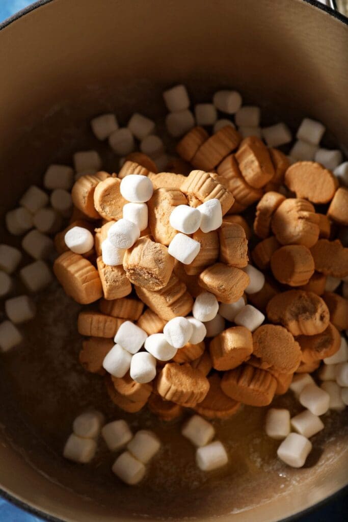 Pumpkin spice marshmallows and mini marshmallows in a pot with butter