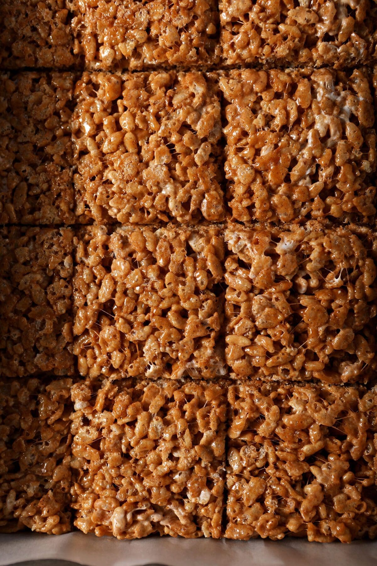 Sliced Pumpkin Spice Rice Krispie Treats in a pan