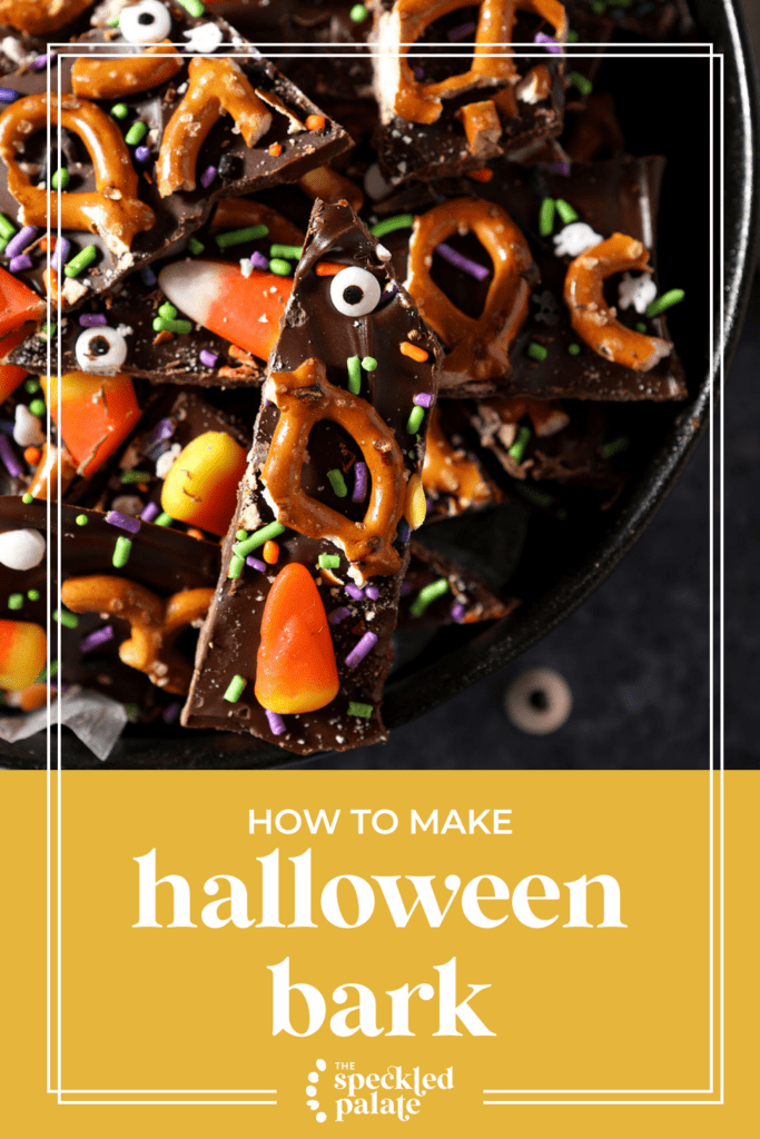 sliced halloween bark with candy eyeballs, pretzels, sprinkles and candy corn in a black bowl on a blue surface with the text how to make halloween bark