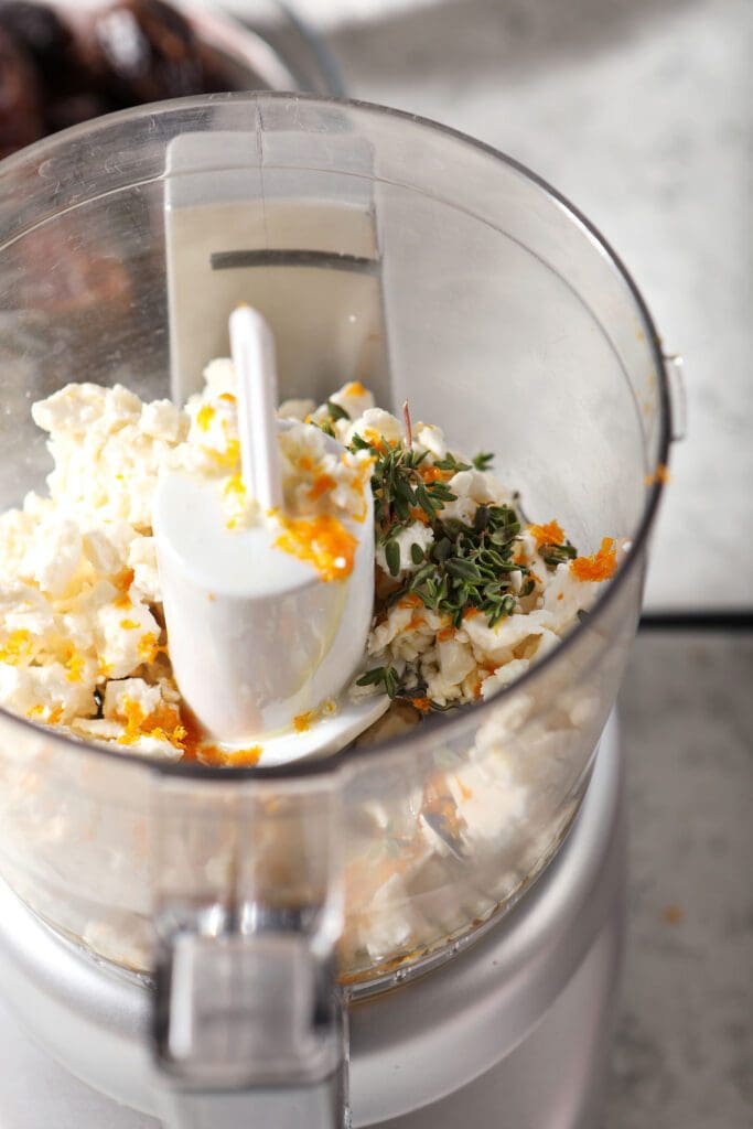 Feta cheese and other filling ingredients in a food processor, before blending