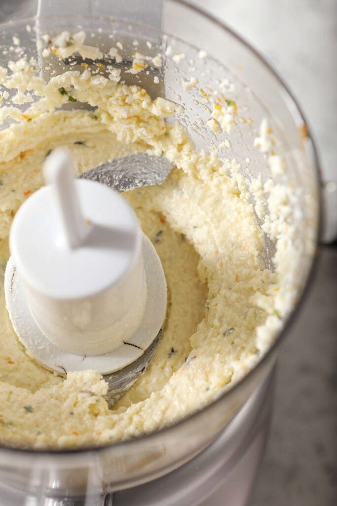 Feta cheese and other filling ingredients in a food processor, after blending