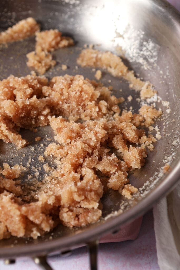 Pecan glaze ingredients mixed together in a skillet before the sugar has melted