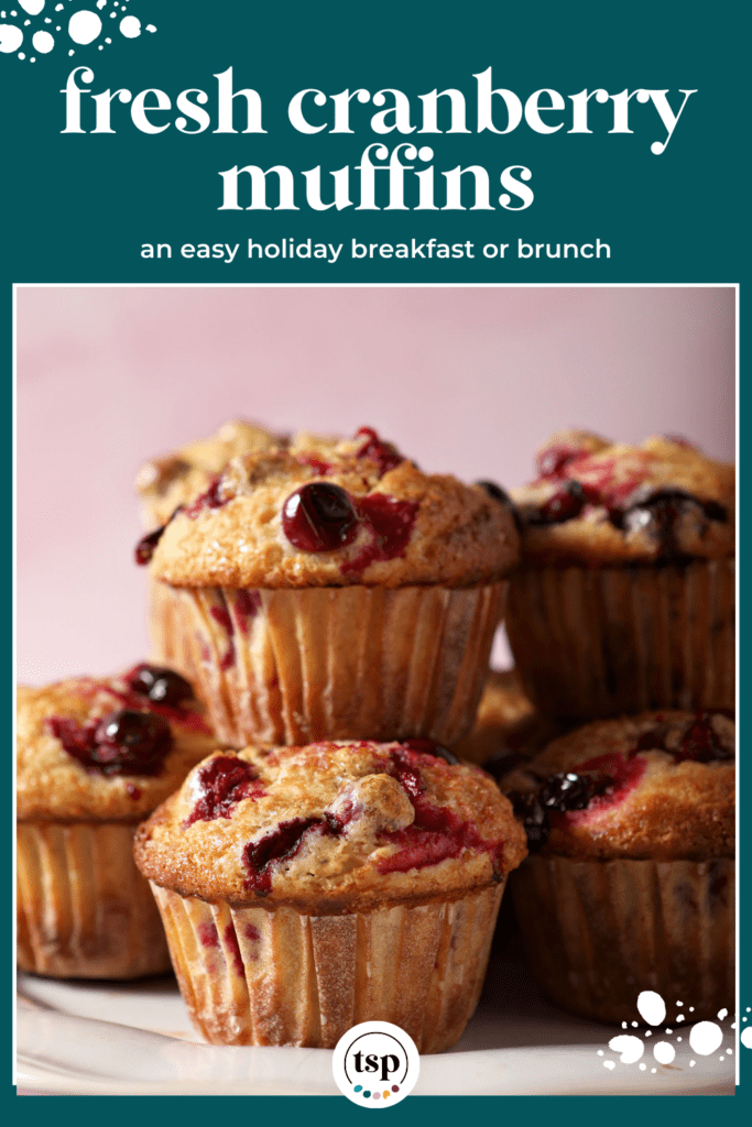 A white plate holds several Cranberry Muffins stacked on top of each other with the text fresh cranberry muffins an easy holiday breakfast or brunch