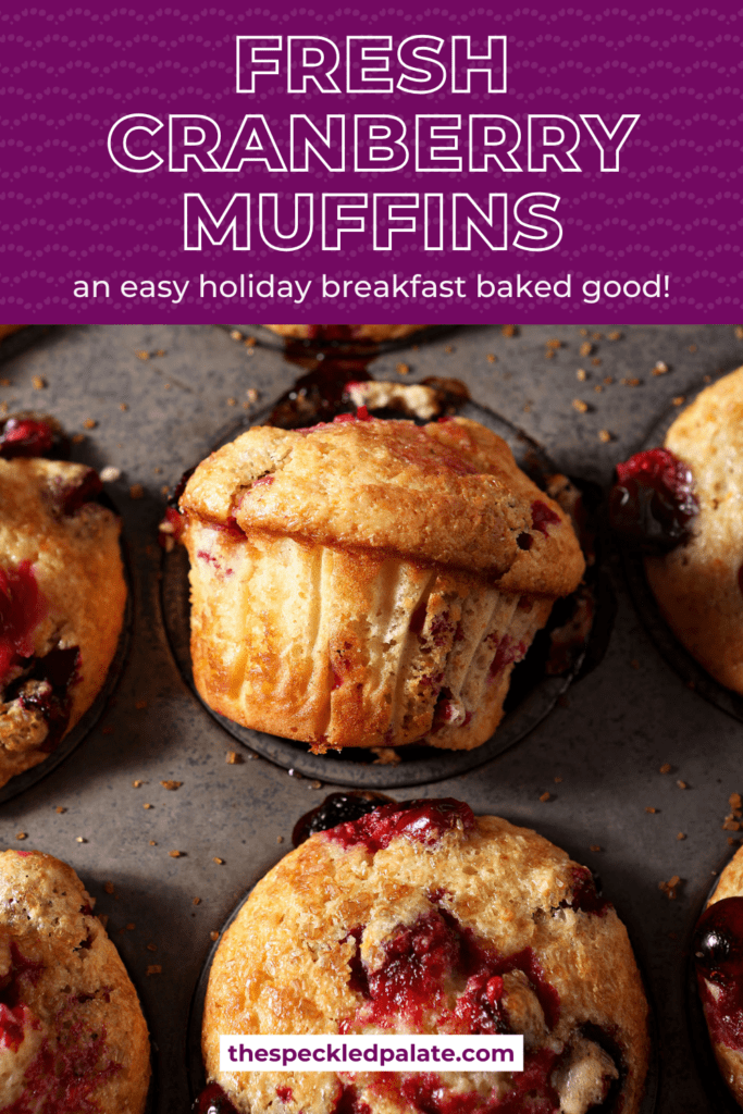 Cranberry muffins in a muffin tin after baking, with one muffin turned on its side with the text Fresh Cranberry Muffins an easy holiday breakfast baked good