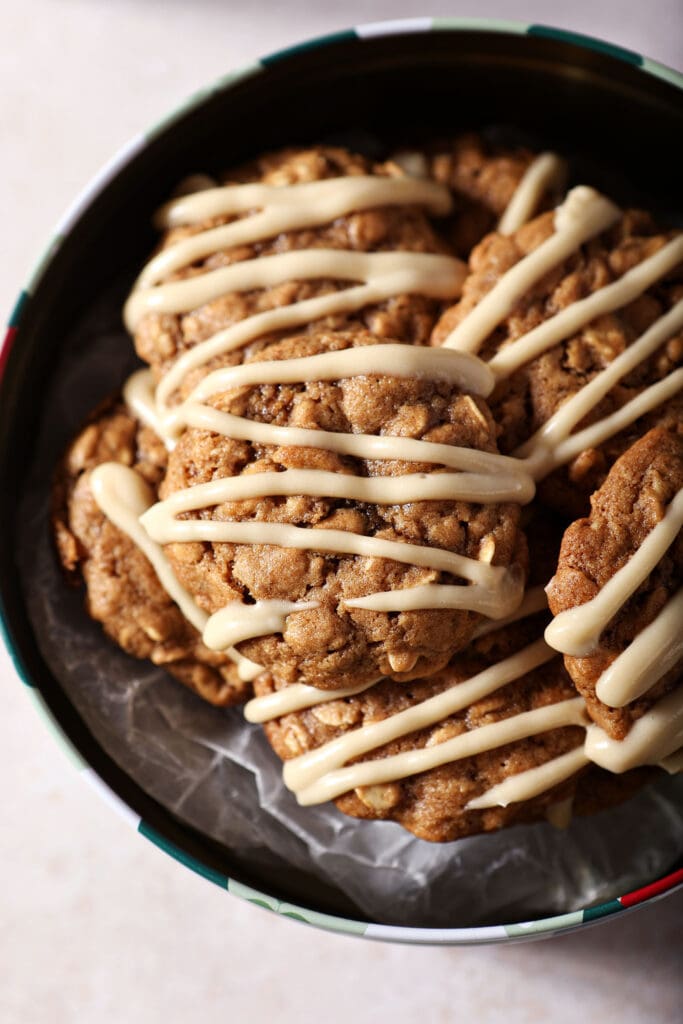 A cookie tin of Cinnamon Oatmeal Cookies with Maple Cream Cheese Glaze from above