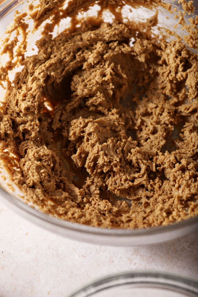 Creamed brown sugar and butter in a bowl to make cookies