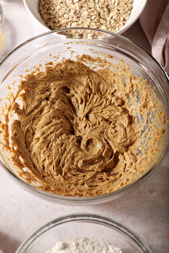 Creamed wet ingredients for oatmeal cookies in a bowl