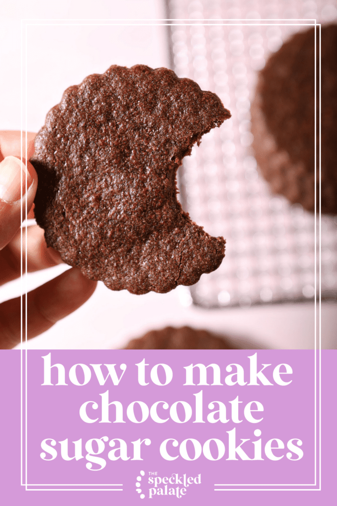 A hand holds a bitten-into chocolate sugar cookie above a pink surface holding more cookies with the text how to make chocolate sugar cookies