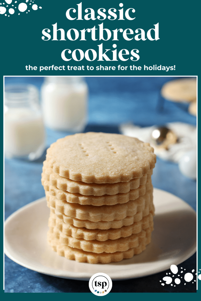 scalloped cookies stacked on a white plate on a blue surface with the text classic classic shortbread cookies the perfect treat to share for the holidays