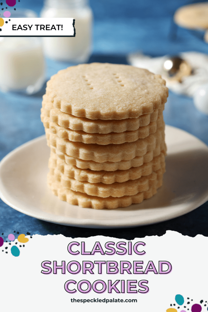 scalloped cookies stacked on a white plate on a blue surface with the text classic shortbread cookies