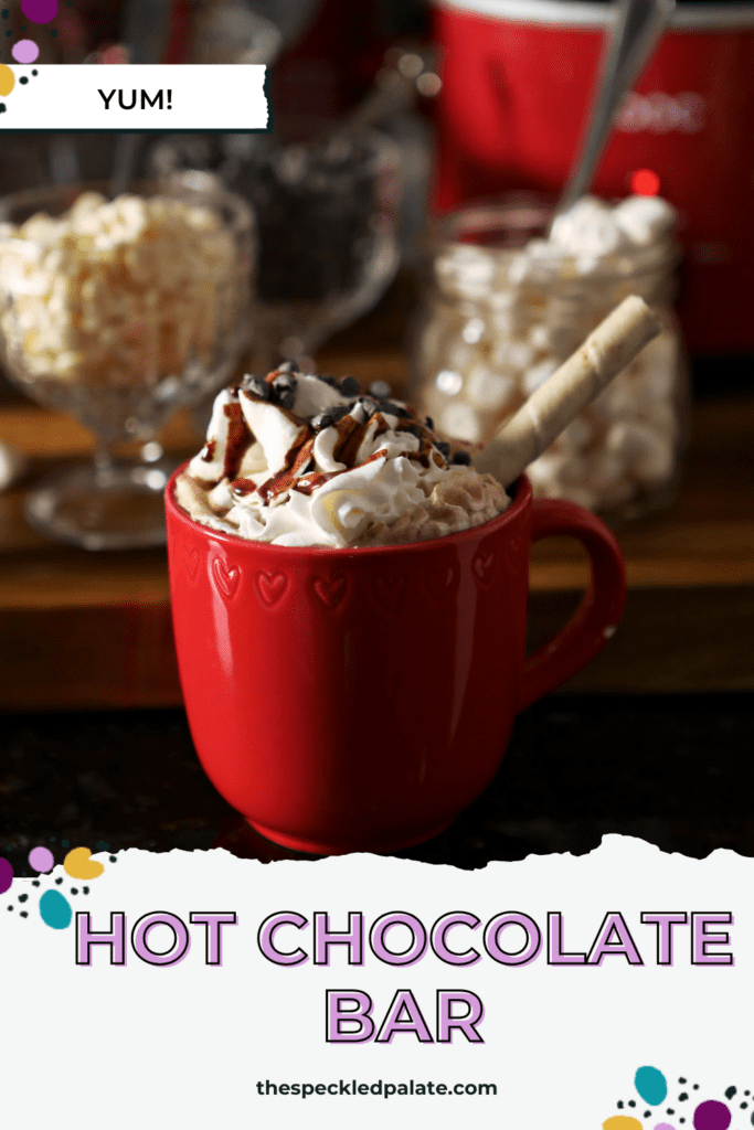 A mug of cocoa topped with whipped cream and chocolate syrup with the text hot chocolate bar