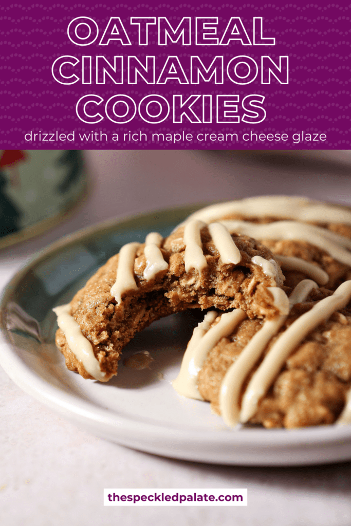 A bitten into Cinnamon Oatmeal Cookie on a plate with two others next to a Christmas tree cookie tin and a pink linen with the text oatmeal cinnamon cookies drizzled with a rich maple cream cheese glaze