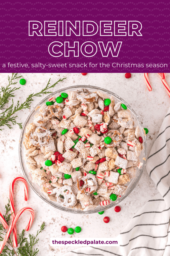 A bowl of reindeer chow with colorful M&Ms and peppermints on a white background surrounded by more Christmas candy with the text reindeer chow a festive, salty-sweet snack for the christmas season