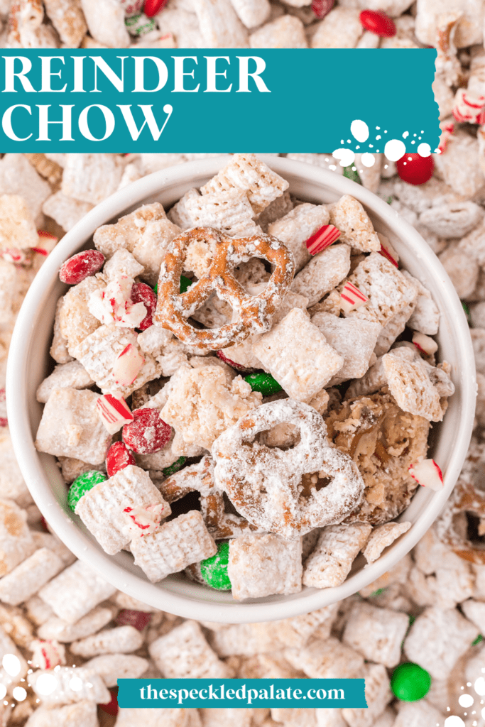 A bowl of reindeer chow on a sheet pan of more reindeer chow with the text reindeer chow