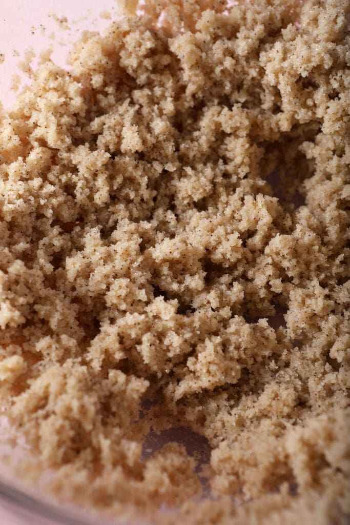 Close up of blended sugar, espresso powder and butter in a bowl