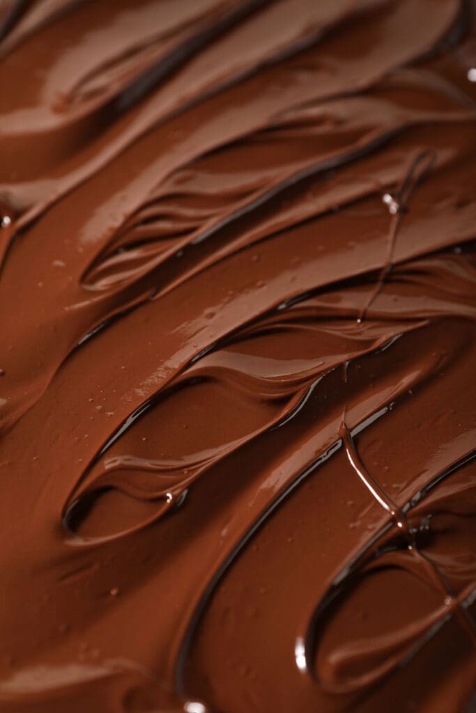 Melted chocolate swirled on a pan