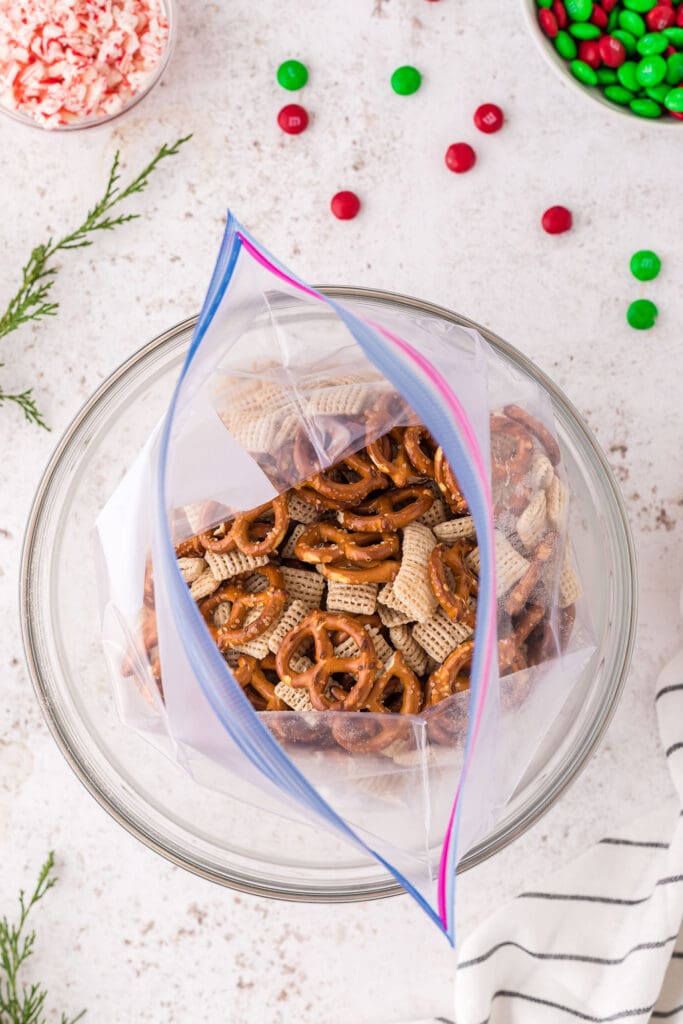 Pretzels and Chex mix in a tiptop bag inside a bowl