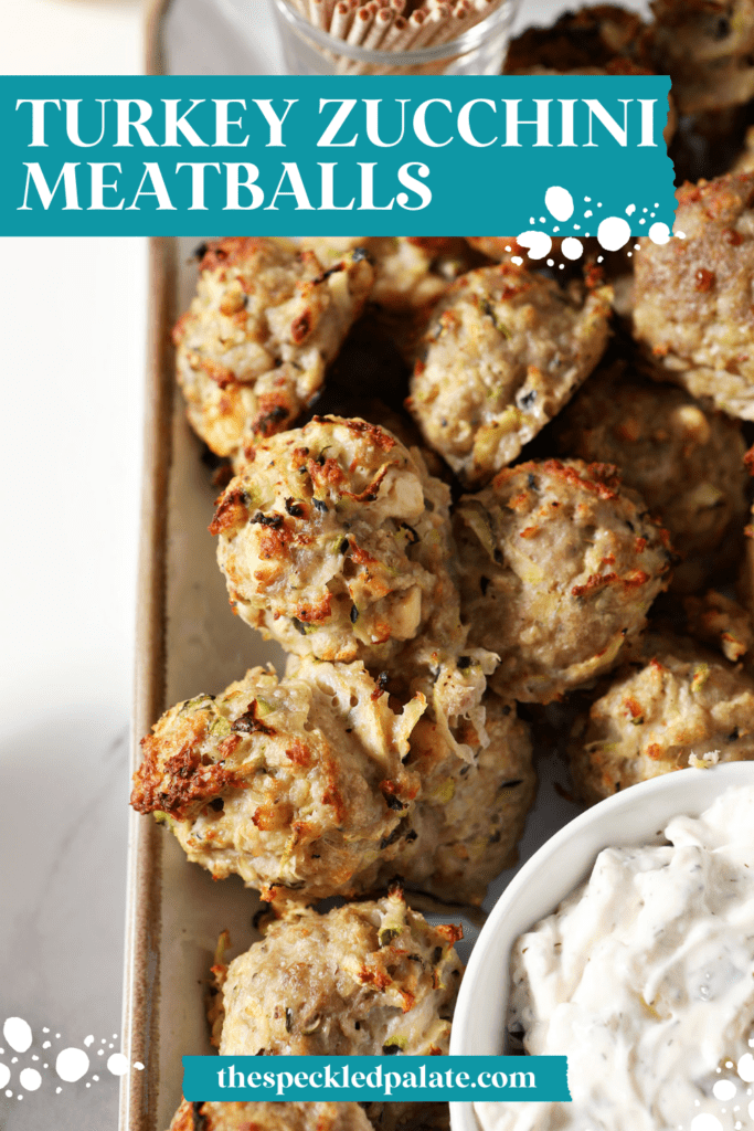 Baked turkey meatballs with zucchini on a plate with tzatziki sauce with the text turkey zucchini meatballs