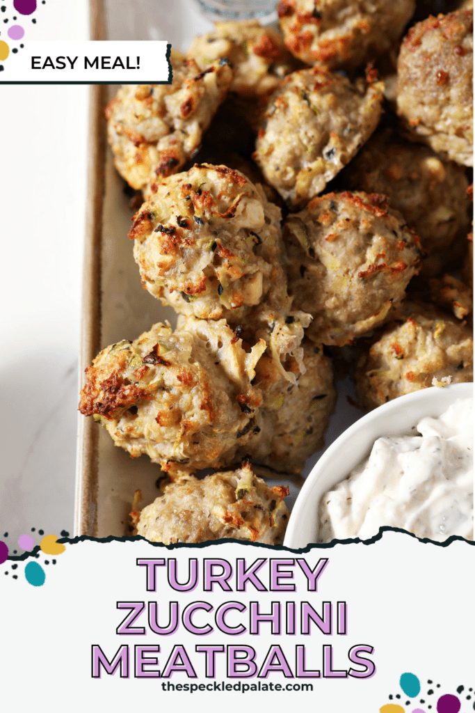 Baked turkey meatballs with zucchini on a plate with tzatziki sauce with the text turkey zucchini meatballs