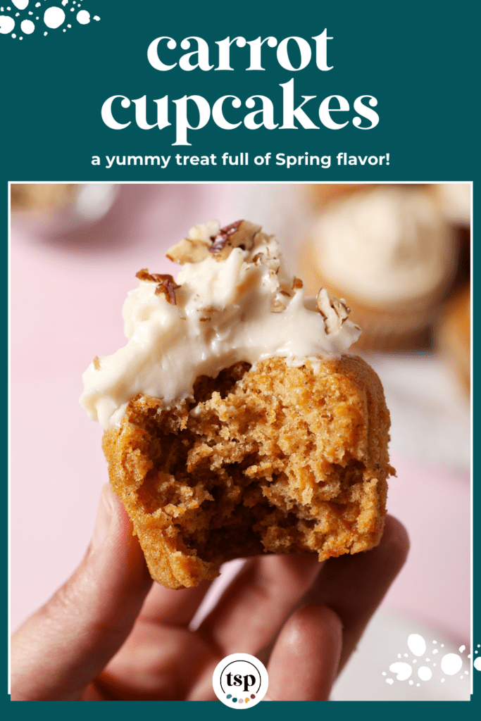 A hand holds a bitten-into Carrot Cake Cupcake with cream cheese frosting with the text carrot cupcakes a yummy treat full of spring flavor