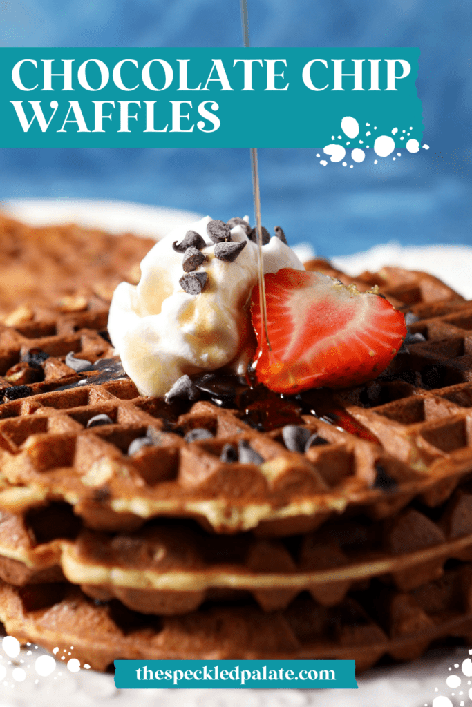 syrup pours on top of a stack of chocolate chip waffles topped with a halved strawberry and whipped cream with the text chocolate chip waffles