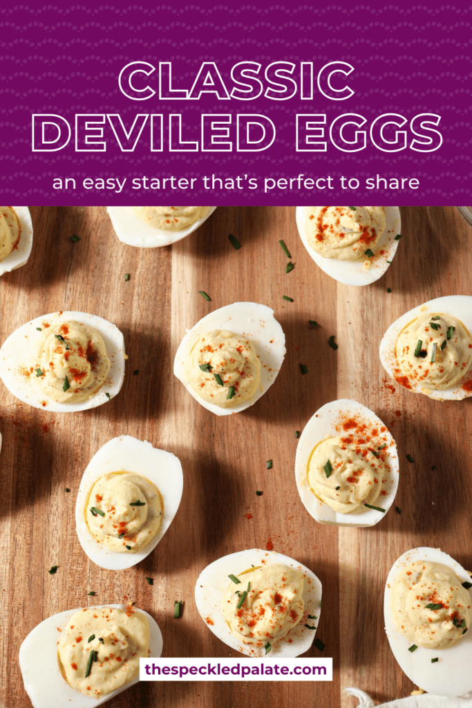 Deviled eggs on a wooden platter from above on a blue and white tile surface with the text classic deviled eggs and easy starter that's perfect to share