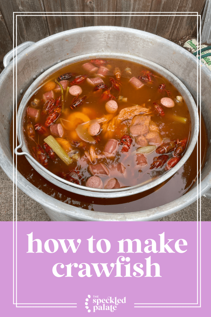 a pot of crawfish from above as it simmers over a propane flame over grass with the text how to make crawfish