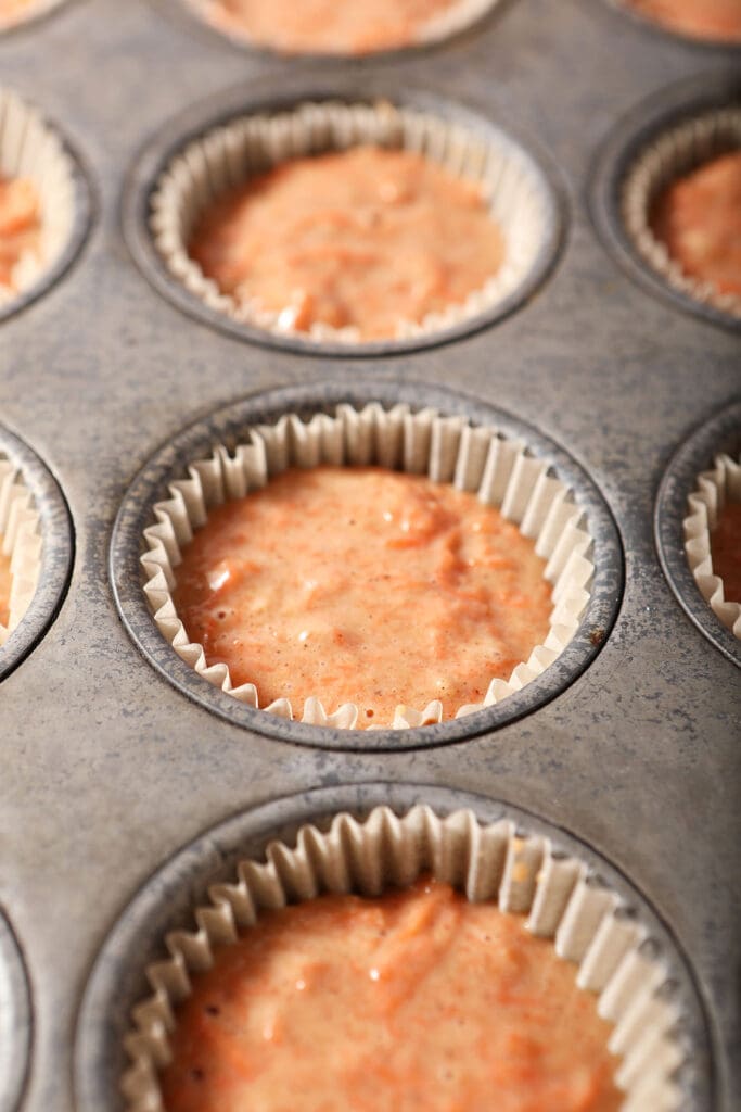 Carrot cupcake batter in a tin before baking