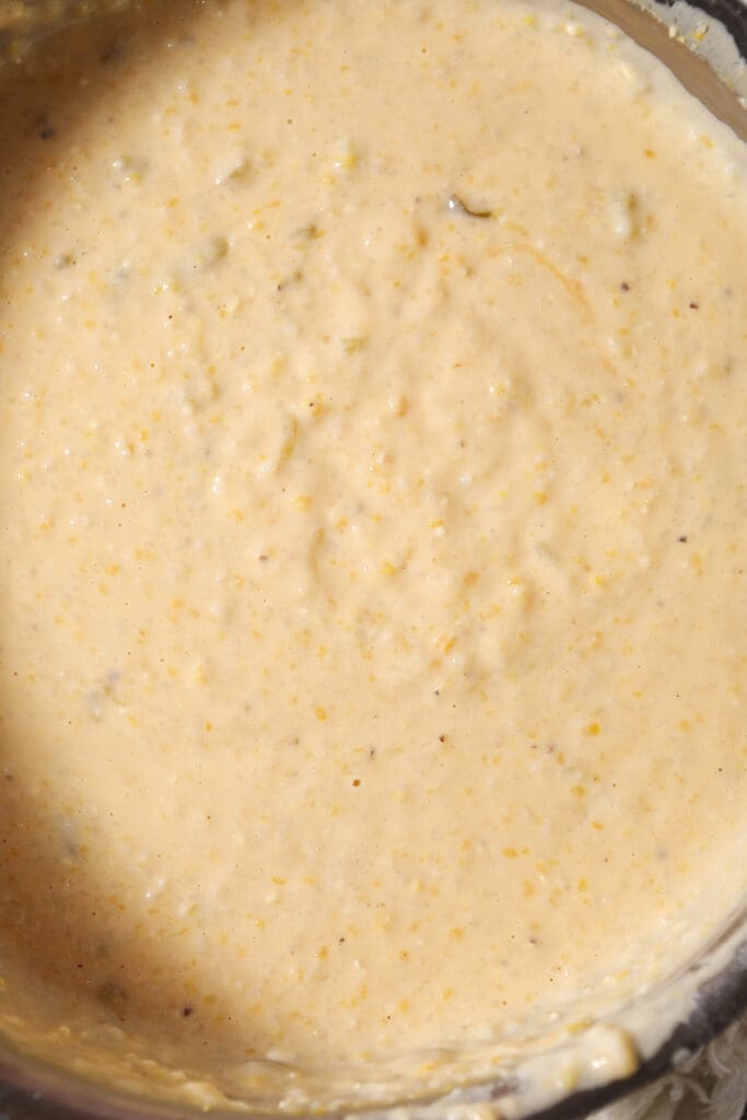 close up of cheese grits in a pan