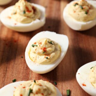 Close up of deviled eggs on a wooden board