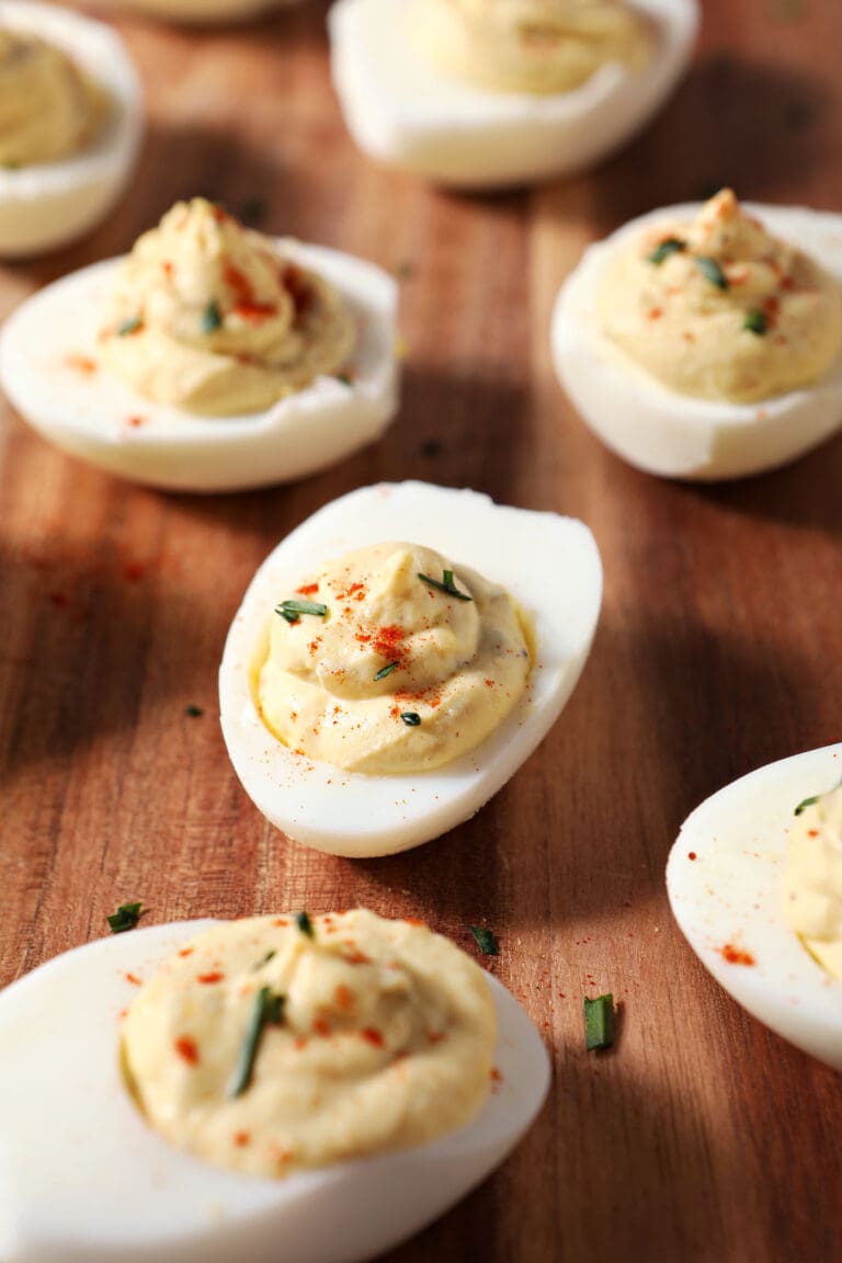 Close up of deviled eggs on a wooden board