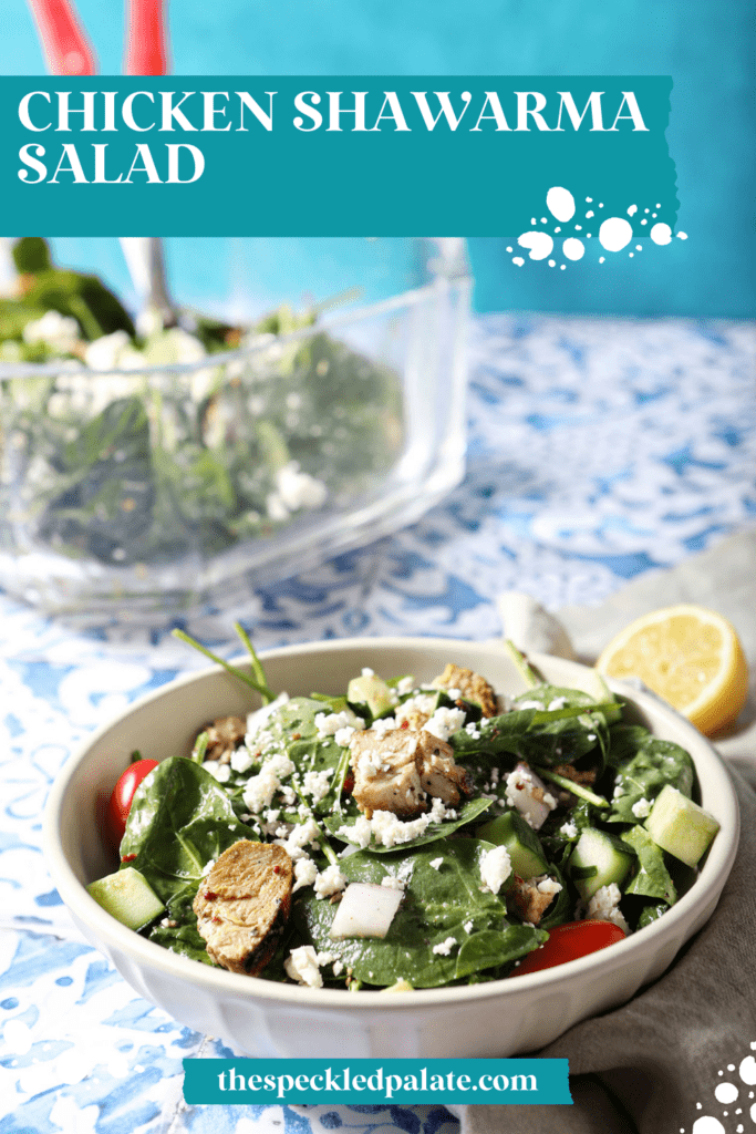 A bowl of chicken shawarma salad on a blue and white tiled surface with the text chicken shawarma salad