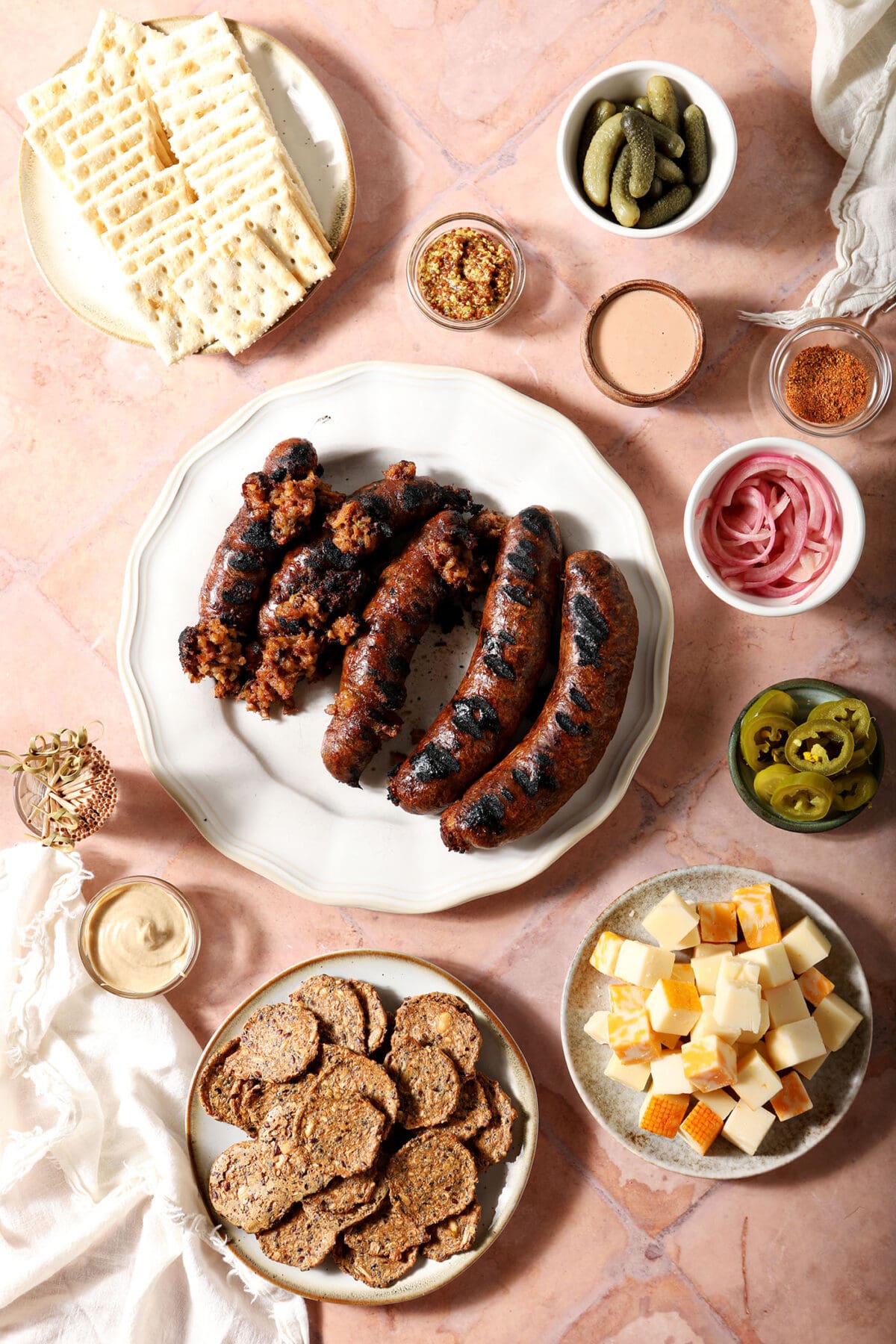 Ingredients to make a boudin board on a orange tiled surface