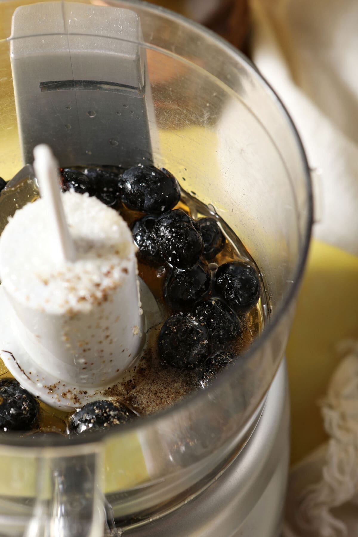 Ingredients to make blueberry dressing in a mini food processor